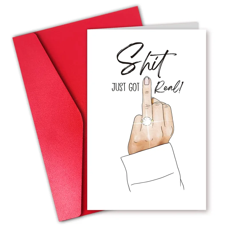 Engagement Ring Joke Card – Hand showing ring, Shit Just Got Real! printed on white card – Greeting Card in black