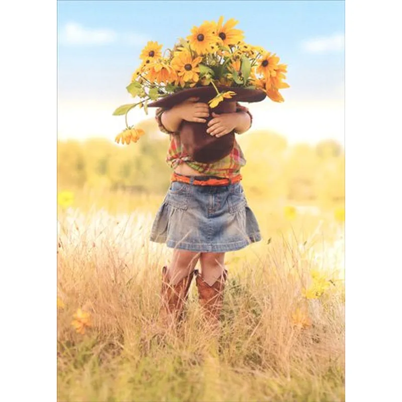 Sunflower Hat Card – Girl in cowboy boots holding a hat of sunflowers in a field – Greeting Card in black