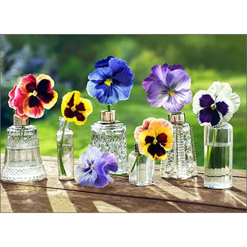 Pansies in Glass Vases Card – Colorful pansies in vintage glass vases on a wooden table – Greeting Card in natural
